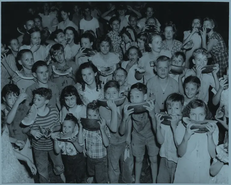 Children enjoy watermelon